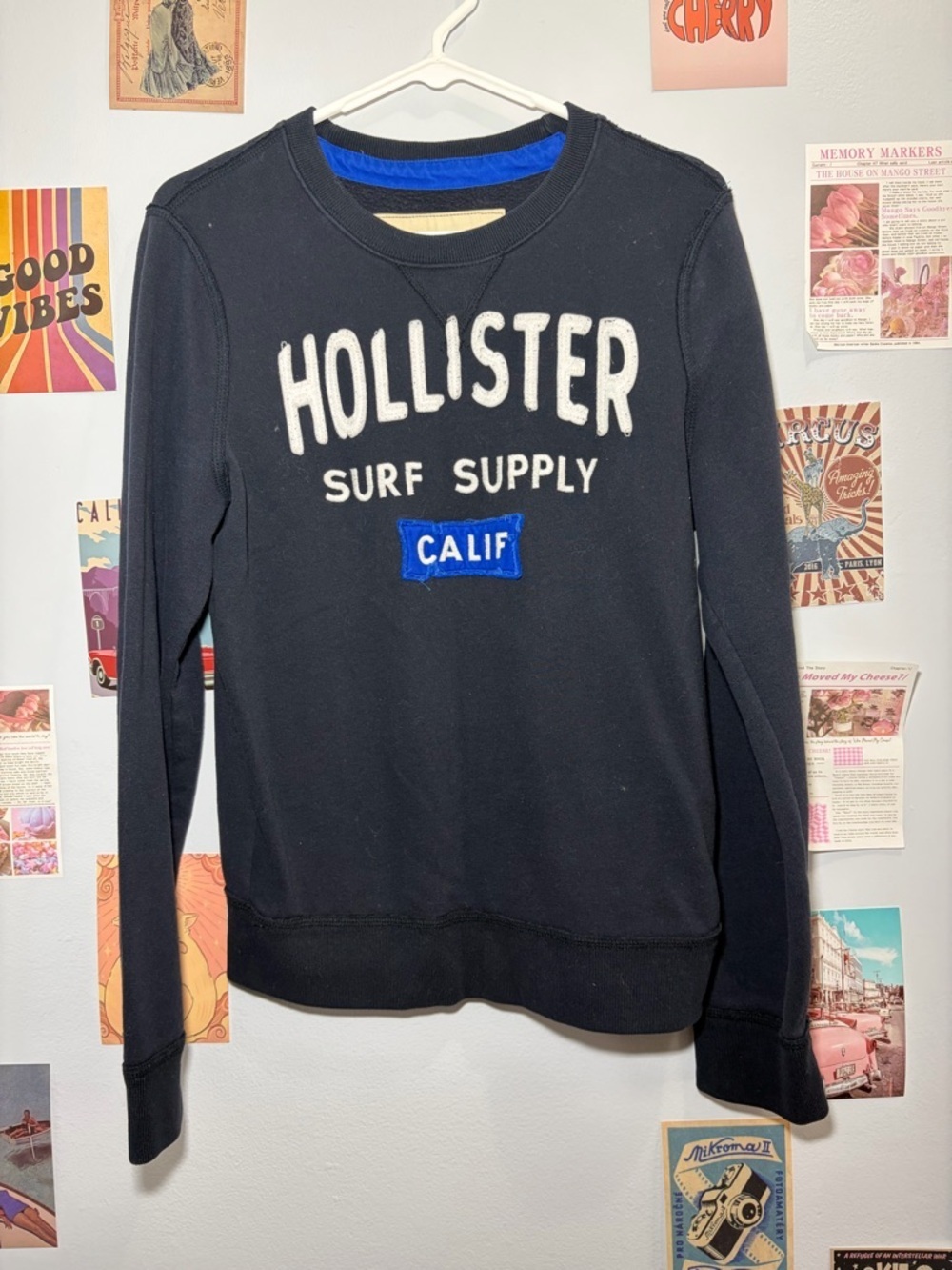 Hollister Black Crewneck Sweatshirt with White Logo and Blue Patch